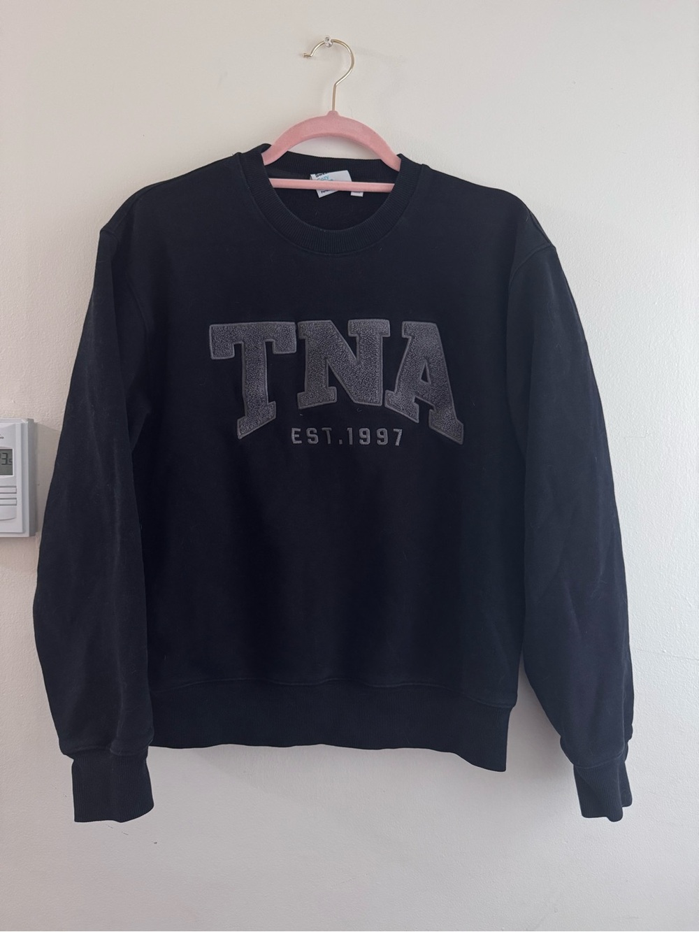 Aritzia TNA Black Crewneck Sweatshirt with Gray Appliqué